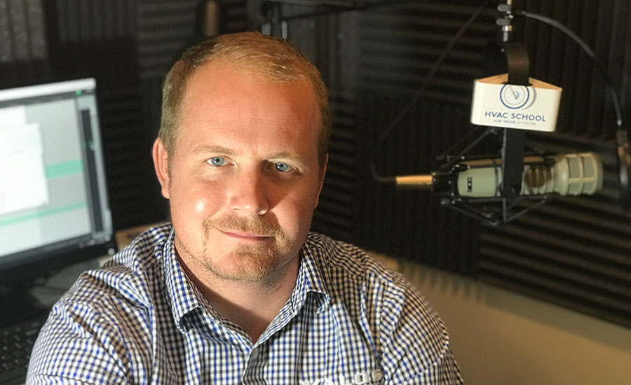 Bryan Orr in the HVAC School podcast studio with microphone